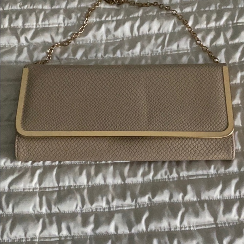 Cream clutch with gold trim and gold chain